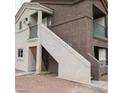 Exterior view of the building with a staircase for upper units at 1505 Frank Aved St # 101, Las Vegas, NV 89110