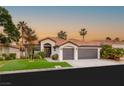 Charming single-story home featuring a tile roof, desert landscaping, and a spacious two-car garage at 1616 Shadow Rock Dr, Las Vegas, NV 89117