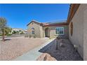 Southwest-style house with xeriscaping and a tiled roof at 2320 Anderson Park Dr, Henderson, NV 89044