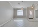 Bright dining area with tile flooring, chandelier, and a large window for natural light at 259 Baring Cross St, Henderson, NV 89074