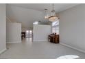 Spacious living room with tile floors, chandelier, and a piano in a naturally-lit room at 259 Baring Cross St, Henderson, NV 89074
