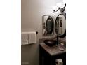 Bathroom featuring a vessel sink and decorative mirrors at 266 Lyra Ln, Las Vegas, NV 89110