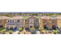 Aerial view showcases this community with ponds and nearby golf course, set against a distant city skyline at 2837 Canonero St, Las Vegas, NV 89142