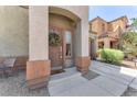 Close-up of the front door with a decorative wreath and a glimpse of the home's exterior at 2837 Canonero St, Las Vegas, NV 89142