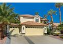 Charming home featuring a tile roof, desert landscaping, and an attached three car garage at 2917 Broken Willow Cir, Las Vegas, NV 89117