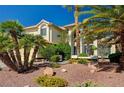 Charming home featuring a tile roof, desert landscaping, and an attached three car garage at 2917 Broken Willow Cir, Las Vegas, NV 89117