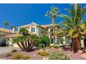 Charming home featuring a tile roof, desert landscaping, and an attached three car garage at 2917 Broken Willow Cir, Las Vegas, NV 89117
