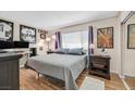 Cozy bedroom with hardwood floors, a double bed, and bright natural light at 3753 Heritage Ave, Las Vegas, NV 89121
