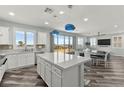 Open kitchen features an island, stainless steel appliances, and access to an outdoor view at 424 Vigo Port St, Las Vegas, NV 89138