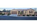 Charming single-story home featuring a three car garage and manicured landscaping for enhanced curb appeal at 4242 Helena Hideaway Ct, Las Vegas, NV 89129