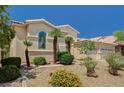Well-maintained desert landscaping enhances this single-story home's curb appeal at 467 Beardsley Cir, Henderson, NV 89052
