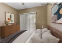 This staged bedroom offers a ceiling fan and a comfy-looking bed at 5655 E Sahara Ave # 1052, Las Vegas, NV 89142