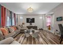 Comfortable living room featuring stylish decor, hardwood floors, and ample seating at 5745 Sagamore Canyon St, North Las Vegas, NV 89081