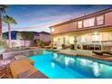Beautiful backyard with a sparkling pool, jacuzzi, and covered patio lounge area at 733 Secret London Ave, Las Vegas, NV 89178