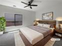 Modern bedroom with a platform bed, large window, and neutral decor at 7873 Running Doe Ct, Las Vegas, NV 89149