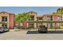 Apartment building with mature landscaping, covered parking, and convenient access to units on multiple levels at 8000 Badura Ave # 1007, Las Vegas, NV 89113