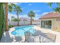 Inviting pool area with a sparkling pool, perfect for summer days, and a covered patio for shaded relaxation at , Henderson, NV 89074
