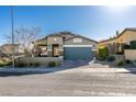 Charming single-Gathering home with a well-maintained front yard and a two-car garage at 124 Strone St, Henderson, NV 89012
