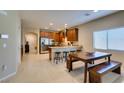 Open kitchen featuring stainless steel appliances, granite countertops, and an island with seating at 124 Strone St, Henderson, NV 89012