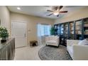 Cozy living room with plush seating, decorative rug, and ample natural light at 124 Strone St, Henderson, NV 89012