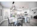 Modern kitchen with stainless steel appliances, a breakfast bar, and gray countertops at 1512 Bellglen Dr, Las Vegas, NV 89128
