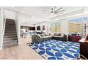 Inviting living room features recessed lighting, a modern ceiling fan, and an open concept floorplan at 245 Hull St, Henderson, NV 89015
