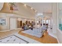 Open-concept living area with high ceilings, stylish furnishings, and a grand, airy atmosphere at 2500 Wimbledon Dr, Las Vegas, NV 89107