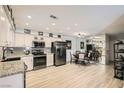 Updated kitchen features granite counters, modern appliances, and adjacent dining area at 2725 S Nellis Blvd # 2084, Las Vegas, NV 89121