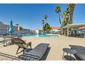 Relaxing community pool area with lounge chairs and palm trees offering ample sunshine at 2725 S Nellis Blvd # 2084, Las Vegas, NV 89121