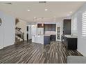Open layout showcasing the kitchen with an island, breakfast bar, and modern appliances at 3096 Beaux Art Ave, Henderson, NV 89044