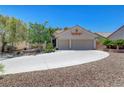 Charming one-story home with a two-car garage and desert landscaping at 4197 Bottiglia Ave, Las Vegas, NV 89141