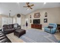 A comfortable living room with tile floors and vaulted ceilings, ideal for relaxation at 5020 Linkside Dr, Las Vegas, NV 89130