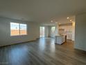 Open-concept living room with hardwood floors and plenty of natural light at 5163 Capucina St # Lot 3, Las Vegas, NV 89122