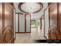 Elegant entry foyer featuring marble floors and ornate wooden trim at 9101 Alta Dr # 102, Las Vegas, NV 89145