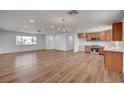 Open living space with light wood floors and abundant natural light, adjacent to the modern kitchen at 929 Center St, Henderson, NV 89015