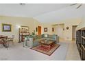 Bright living room with large sectional sofa and ample natural light, inviting you to relax at 967 Cardelina Ln, Henderson, NV 89052