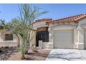 Delightful one-story home featuring desert landscaping, a tile roof, and gated front entry at 10113 Plomosa Pl, Las Vegas, NV 89134