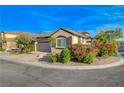 Lovely home on a corner lot featuring mature landscaping and a well-maintained lawn at 11441 Drappo Ave, Las Vegas, NV 89138