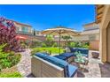 Inviting backyard featuring a patio with comfortable seating, a lush lawn, and a serene outdoor ambiance at 12286 Silvana St, Las Vegas, NV 89141