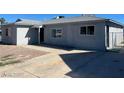 A single-story home featuring a side entrance and updated windows at 2036 Canosa Ave, Las Vegas, NV 89104