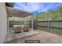 Cozy outdoor patio area with stylish furniture and a fenced-in yard for privacy at 207 E Van Wagenen St, Henderson, NV 89015