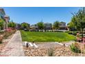 Beautifully maintained community green space with lush landscaping and sidewalks at 2870 Turnstone Ridge St, Henderson, NV 89044