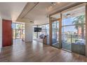 Spacious living area with floor-to-ceiling windows and a balcony with city views and natural light at 353 E Bonneville Ave # 379, Las Vegas, NV 89101