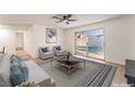 Inviting living room features sliding glass door access to the outdoor pool area at 4301 Fortune Ave, Las Vegas, NV 89107