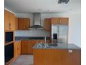 Modern kitchen with stainless steel appliances, granite countertops, and custom cabinetry at 4575 Dean Martin Dr # 3206, Las Vegas, NV 89103