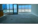 Bright living room with floor-to-ceiling windows offering stunning city views at 4575 Dean Martin Dr # 3206, Las Vegas, NV 89103