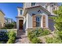 Charming two-story home featuring a stylish entry gate and complemented by well-maintained landscaping at 459 Astillero St, Las Vegas, NV 89138