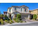 Beautiful two-story home with a two-car garage, manicured landscaping, and a welcoming entrance at 459 Astillero St, Las Vegas, NV 89138