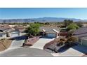 Beautiful aerial view of home showcasing desert landscape and mountain views in the distance at 5480 Lincolnwood Ct, Pahrump, NV 89061