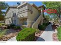 Charming two-story condo with private balcony, landscaped grounds, and convenient stair access at 5710 E Tropicana Ave # 2178, Las Vegas, NV 89122
